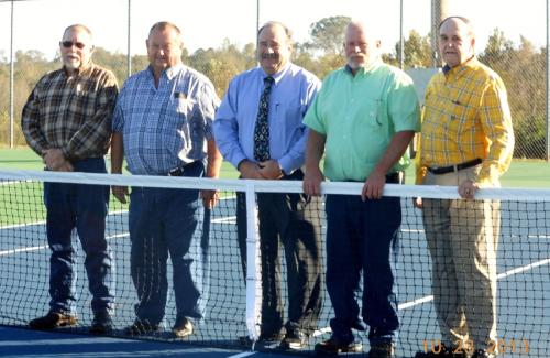 Commissioners on a tennis court