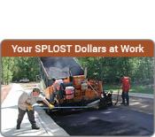 Your SPLOST Dollars at Work - Two workers paving a road