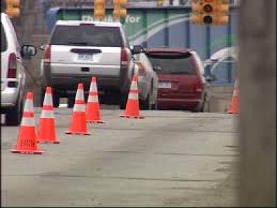 Cars on road with traffic cones